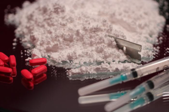 Slideshow of scenes: buprenorphine bottles, Glide Memorial church, and a clinician with a patient